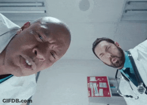 Two Doctors Looking Up At Camera With Red Box GIF