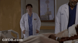 Two Doctors Standing Next To Patient In Hospital Bed With Seattle Picture GIF