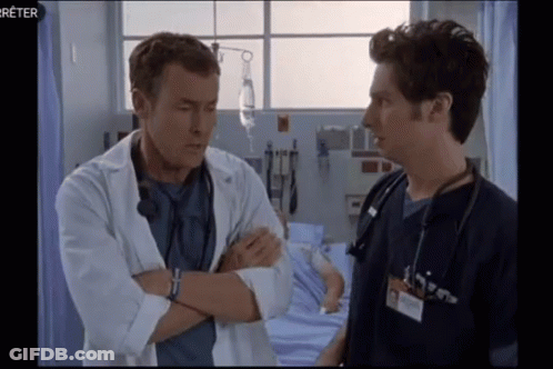 Two Doctors Talking In Hospital GIF
