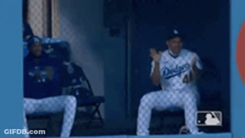 Two Dodgers Baseball Players Sitting GIF