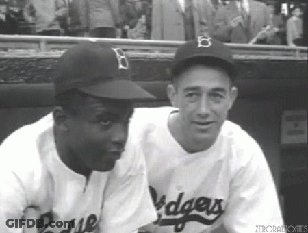 Two Dodgers Players Sitting Together In Dugout GIF