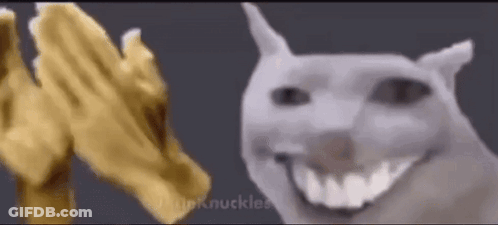 Two Dogs Smiling In Front Of Gold Hand GIF
