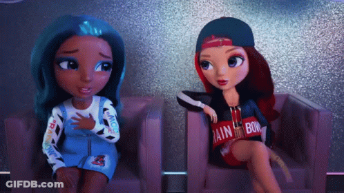 Two Dolls Are Sitting Next To Each Other With One Wearing A Shirt That Says Rainbow GIF