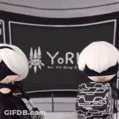 Two Dolls In Front Of Yor Sign GIF