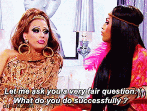 Two Drag Queens Are Sitting Next To Each Other And One Of Them Is Asking The Other What She Does Successfully GIF