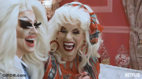 Two Drag Queens Laughing Face To Face GIF