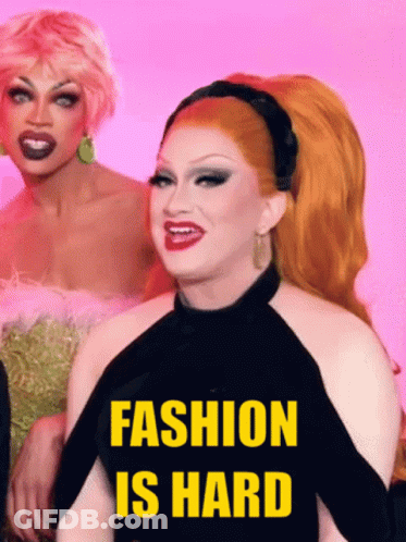 Two Drag Queens Standing Together Saying Fashion Is Hard GIF