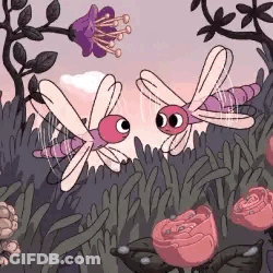 Two Dragonflies Flying Over Flowers GIF