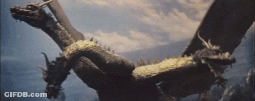 Two Dragons Flying With Wings Outstretched GIF