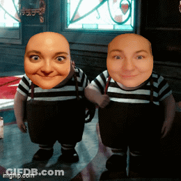 Two Dwarfs With Faces On Table GIF