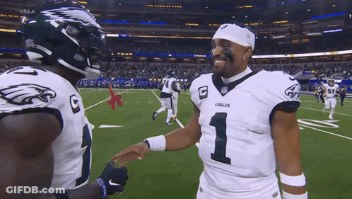 Two Eagles Football Players Shaking Hands GIF