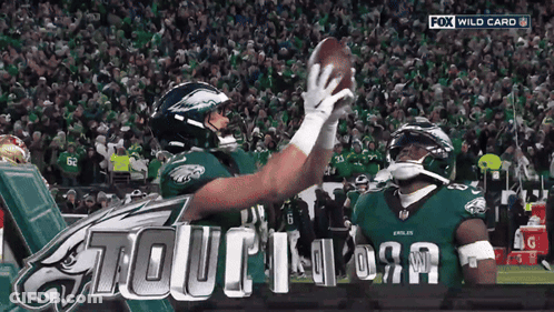 Two Eagles Players Are Celebrating A Touchdown On A Fox Wild Card Broadcast GIF