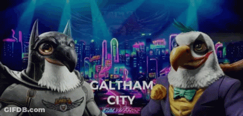 Two Eagles Standing Together In Front Of Galtham City GIF