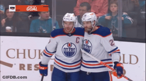 Two Edmonton Oilers Hockey Players Celebrate Their Goal GIF