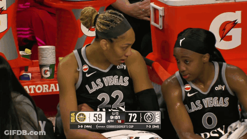 Two Female Basketball Players From The Las Vegas Team Are Sitting On The Bench GIF
