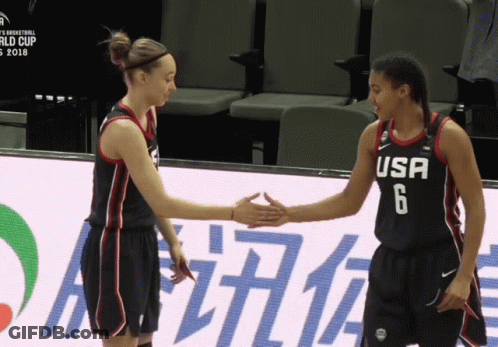 Two Female Basketball Players From The Usa Shake Hands On The Court GIF