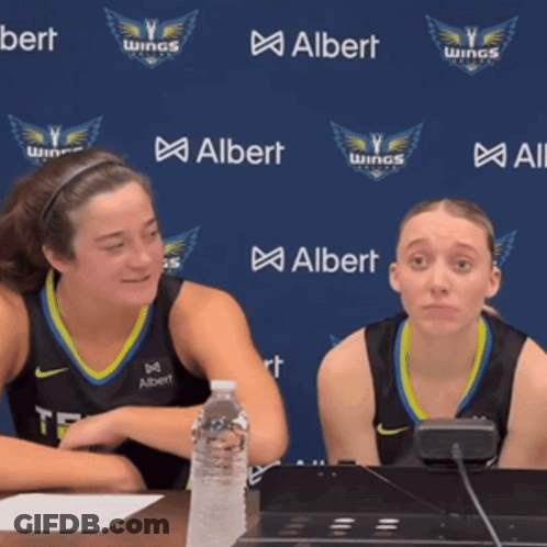 Two Female Basketball Players In Front Of Albert Wall GIF