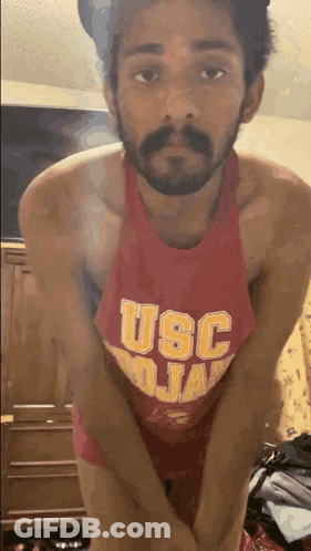 Two Female Basketball Players In Red USC Jerseys GIF