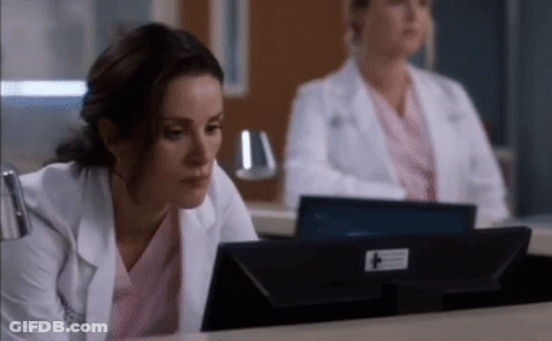 Two Female Doctors Looking At Computer Monitor GIF