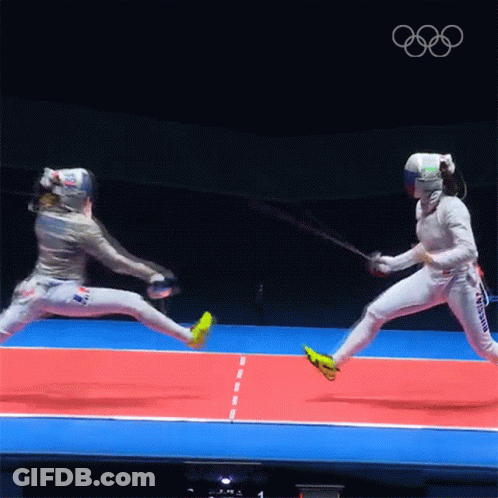 Two Female Fencers Are Fighting On A Red And Blue Court With The Olympics Logo In The Background GIF