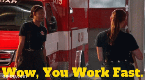 Two Female Firefighters In Front Of Ambulance GIF