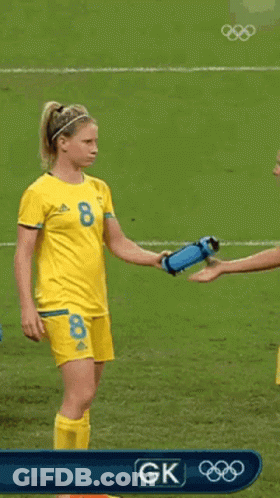 Two Female Soccer Players Drinking Water From Bottles GIF