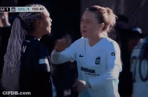 Two Female Soccer Players Hugging In Front Of Scoreboard Saying GFC 1 GIF