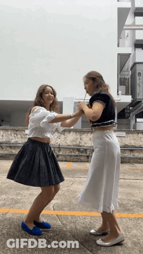 Two Female Soccer Players Hugging On Field With TDP GIF