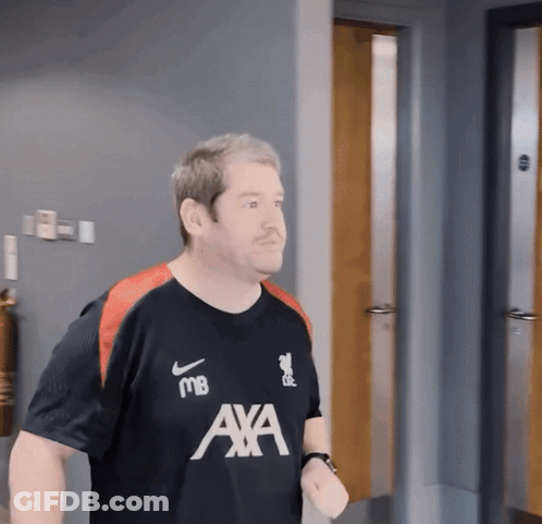 Two Female Soccer Players In Red Standard Chartered Uniforms GIF