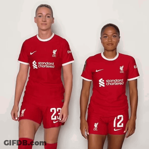 Two Female Soccer Players In Red Standard Chartered Uniforms GIF