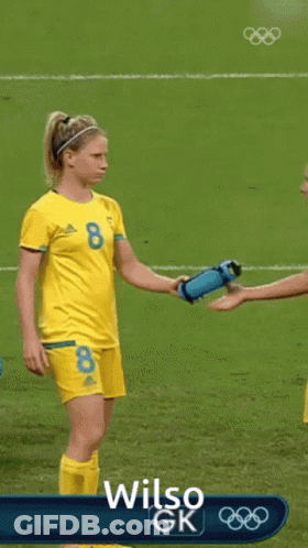 Two Female Soccer Players On Field With Wilso GK GIF