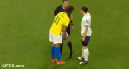 Two Female Soccer Players Talking On Field GIF