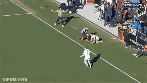 Two Female Soccer Players Talking On Field GIF