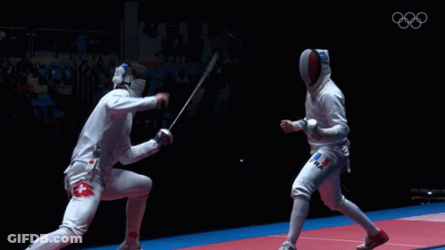 Two Fencers Are Fighting Each Other With The Olympics Logo In The Background GIF