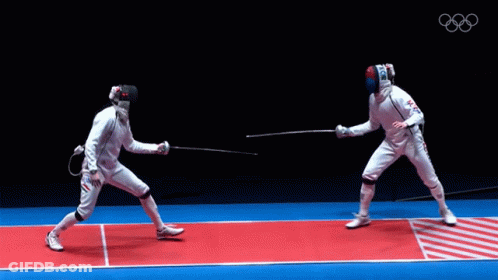Two Fencers Are Fighting On A Red And Blue Mat With The Olympics Logo In The Background GIF