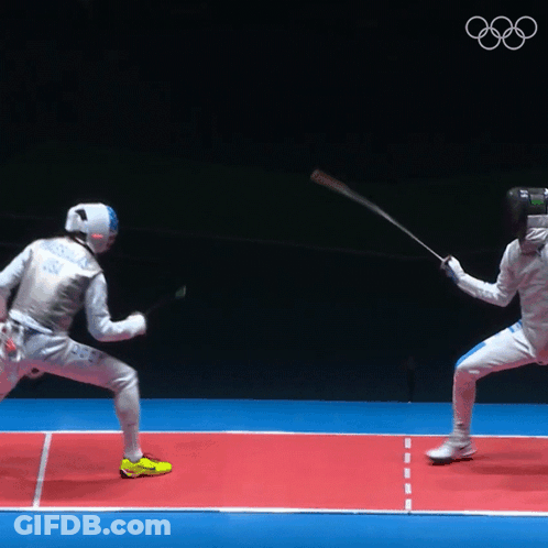 Two Fencers Are Fighting On A Red Court With The Olympics Logo In The Background GIF