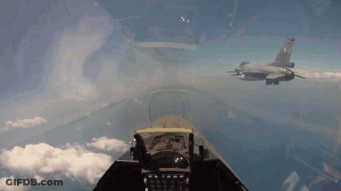 Two Fighter Jets Flying With Greek Flag On One GIF
