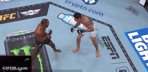 Two Fighters Fighting In Ring With Taurine Can GIF