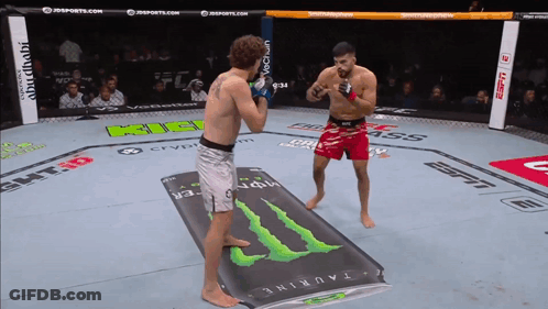 Two Fighters In A Ring With A Monster Energy Drink On The Floor GIF