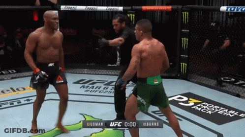 Two Fighters In A Ufc Ring With A Scoreboard That Says Burns At The Bottom GIF