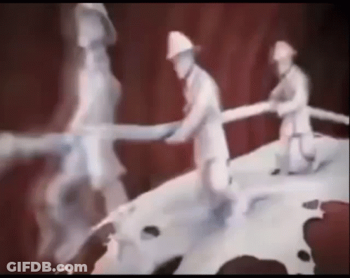 Two Firefighters Holding Hose On Mountain GIF