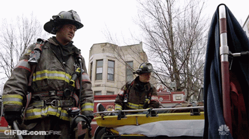 Two Firefighters Next To Stretcher Saying Chicagofire GIF