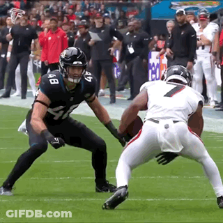 Two Football Players Are Playing A Game And One Has The Number 7 On His Shirt GIF