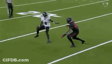 Two Football Players Are Playing A Game On A Field . One Of The Players Is Wearing A Number 8 Jersey . GIF