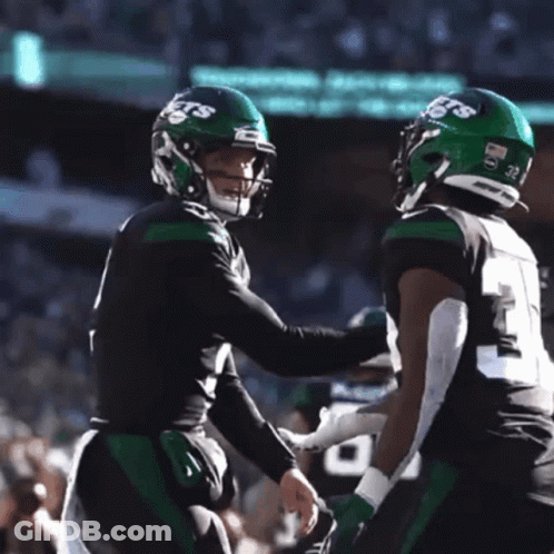Two Football Players Carter And Wilson Hugging GIF