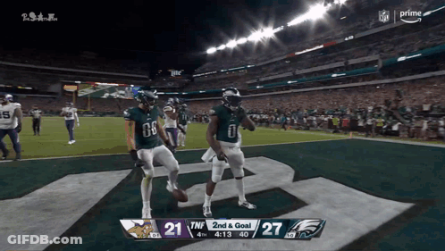 Two Football Players Celebrate 2Nd And Goal GIF