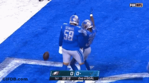 Two Football Players Celebrating Goal GIF