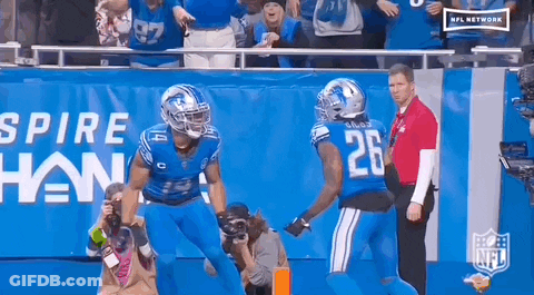 Two Football Players Celebrating Touchdown GIF