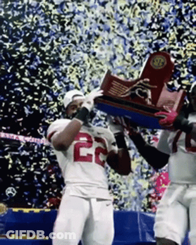 Two Football Players Holding Trophy Jersey 22 GIF