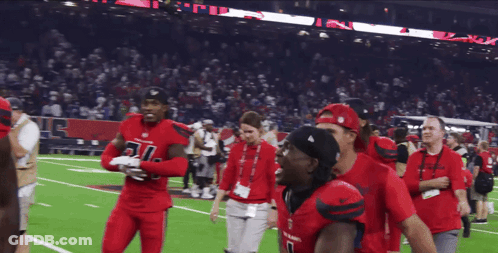 Two Football Players Hugging Number 2 Jersey GIF